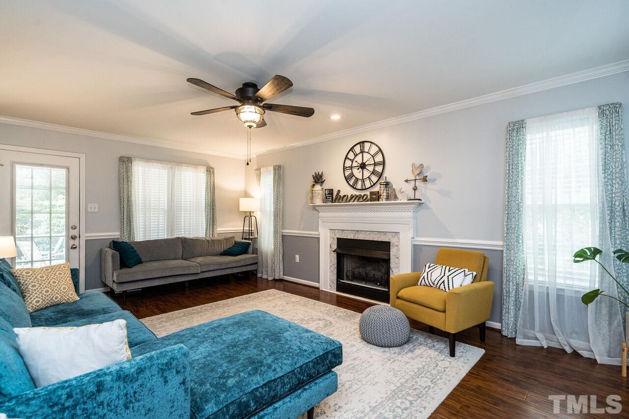 1037 Red Brick Road Garner, NC 27529 - Photo 5 of 33 a living room with furniture and a fireplace