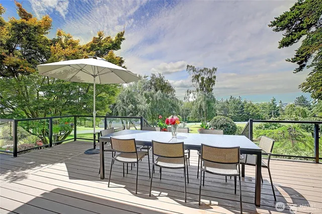 an outdoor space with furniture and umbrella