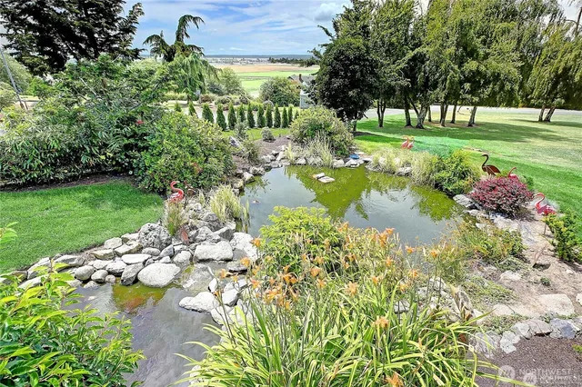 a view of a lake with a yard