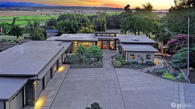 a view of a terrace with a garden and trees