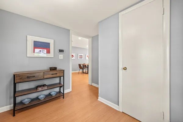 an empty room with furniture and a window
