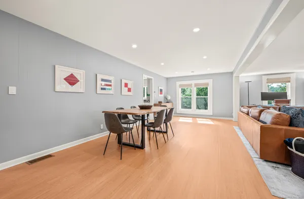 a dining room with furniture and window