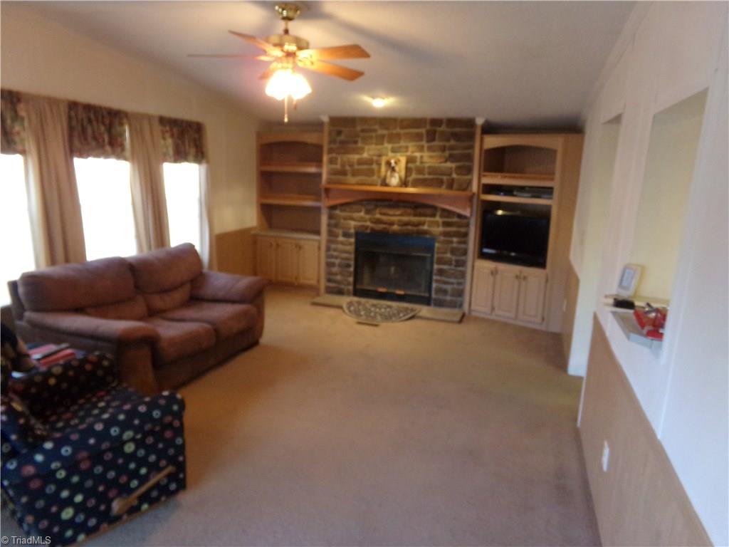 4806 Cashatt Road Trinity, NC 27370 - Photo 8 of 30 Wood burning Fireplace surrounded by built in shelves.