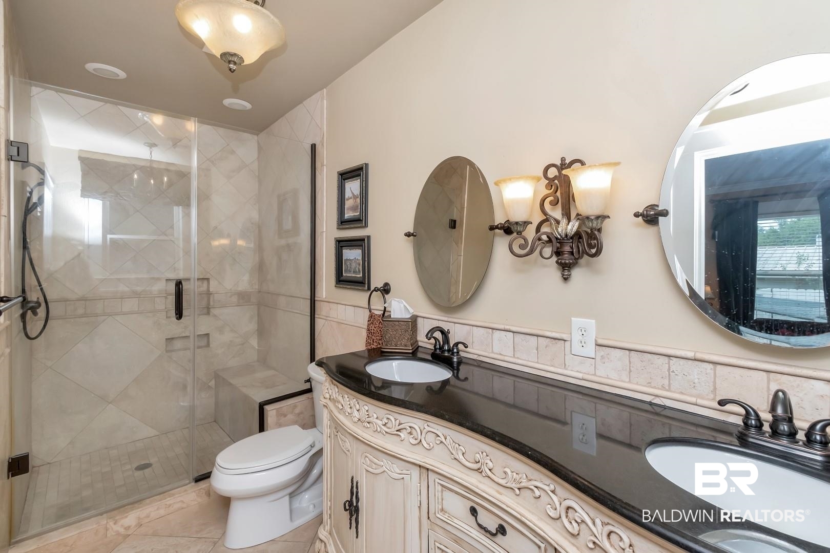 117 South Fulton Street Mobile, AL 36606 - Photo 13 of 34 Bathroom featuring vanity, toilet, an enclosed shower, and tasteful backsplash