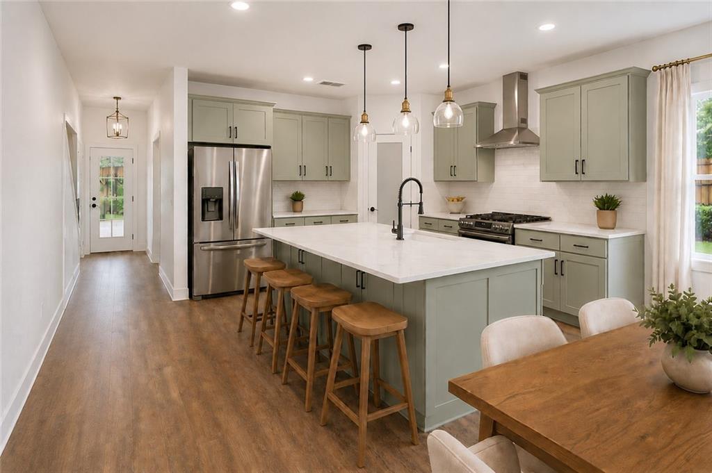135 Old Alabama Road Southeast Emerson, GA 30137 - Photo 19 of 57 a kitchen with stainless steel appliances granite countertop a stove a refrigerator a kitchen island a sink and a refrigerator