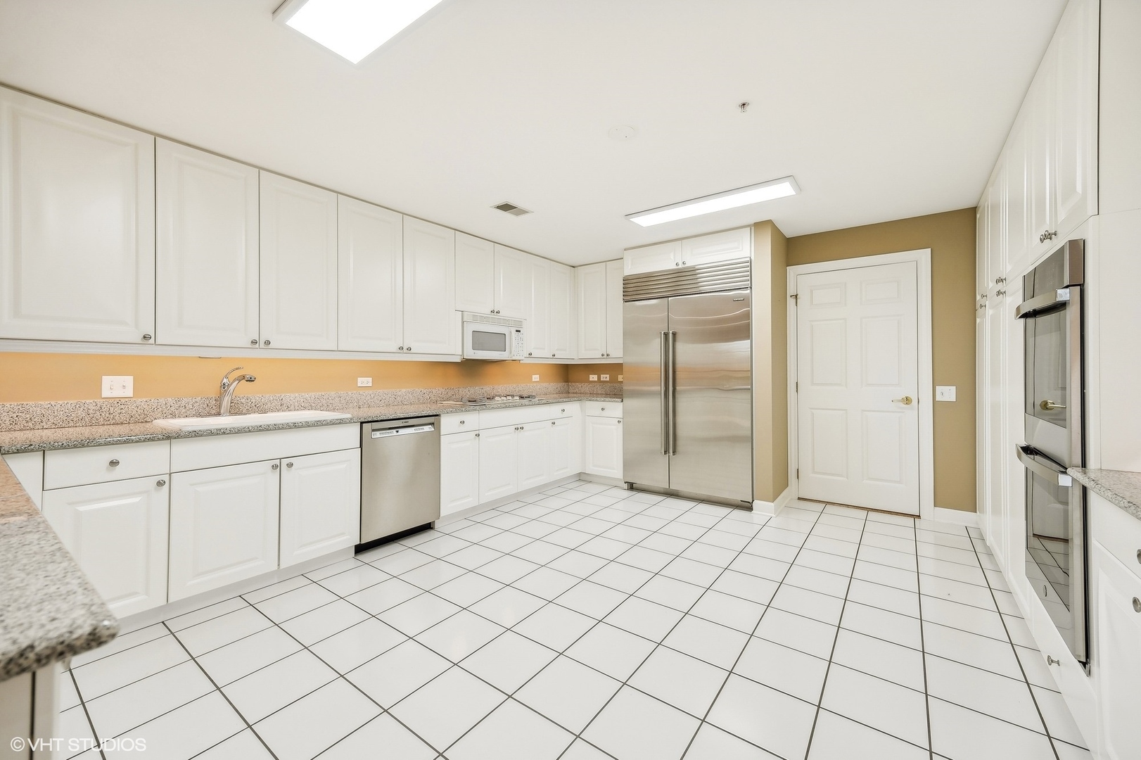 360 Green Bay Road, Unit 3D Winnetka, IL 60093 - Photo 14 of 30 a large white kitchen with white cabinets