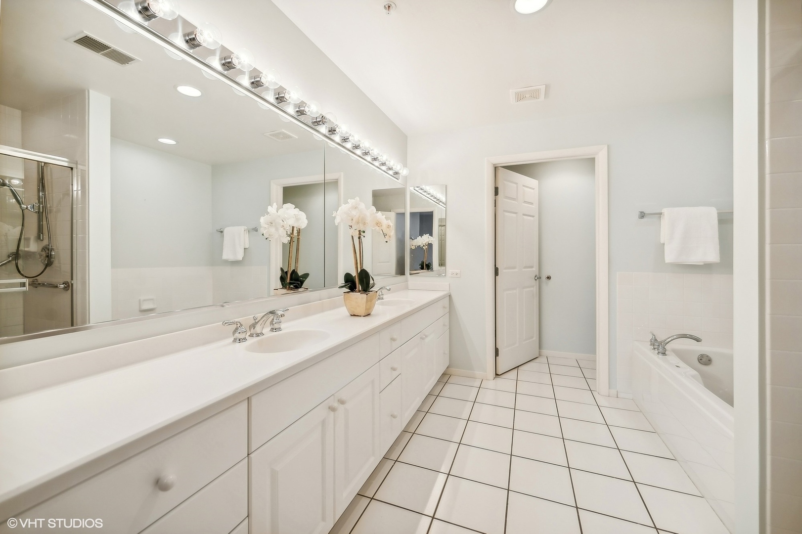 360 Green Bay Road, Unit 3D Winnetka, IL 60093 - Photo 23 of 30 a spacious bathroom with a double vanity sink mirror and shower