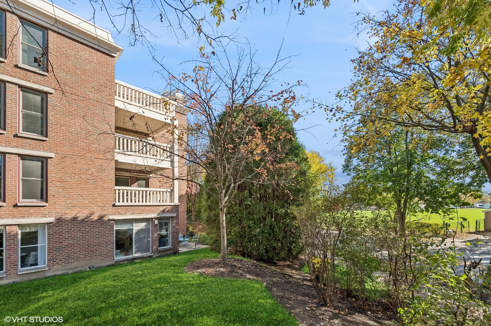 360 Green Bay Road, Unit 3D Winnetka, IL 60093 - Photo 28 of 30 a view of a building with a yard