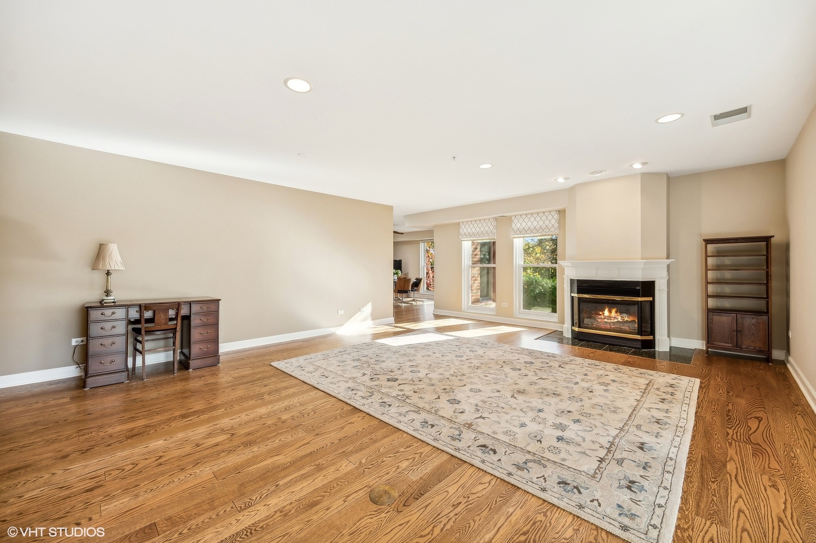 360 Green Bay Road, Unit 3D Winnetka, IL 60093 - Photo 5 of 30 a view of a livingroom with wooden floor and a fireplace