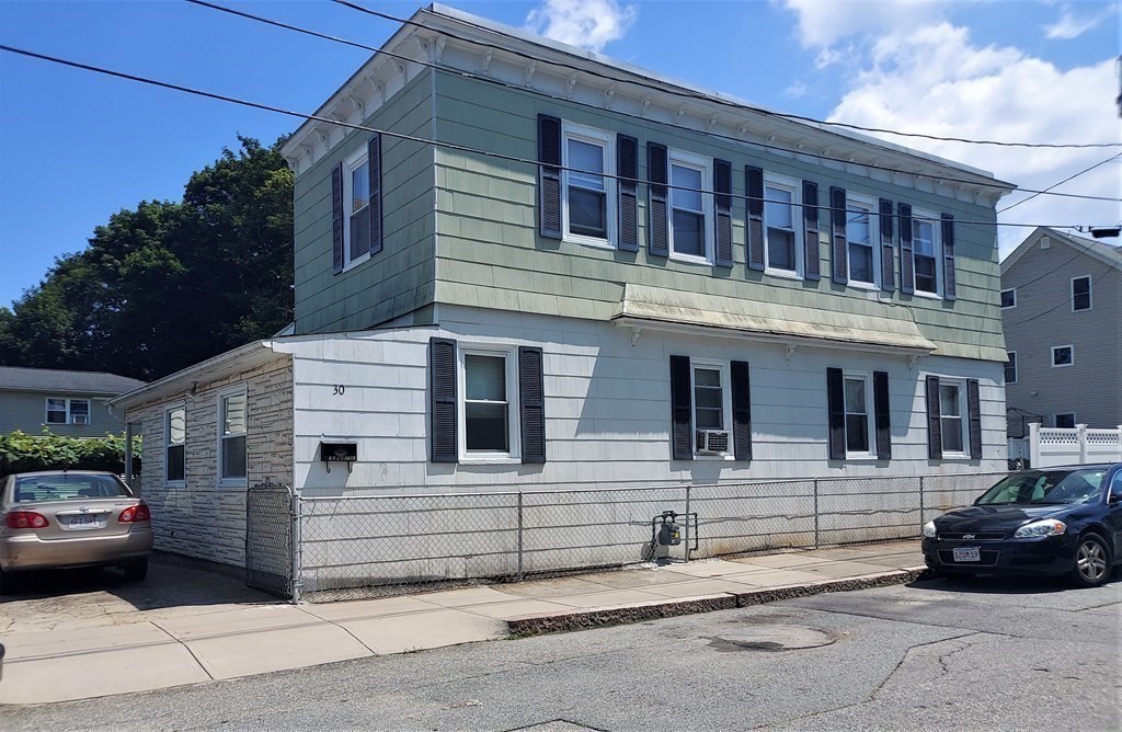 30 Carver Street Fall River, MA 02721 - Photo 1 of 19 a black car parked in front of a building