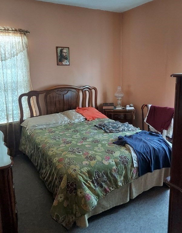 30 Carver Street Fall River, MA 02721 - Photo 15 of 19 a bedroom with a bed and window