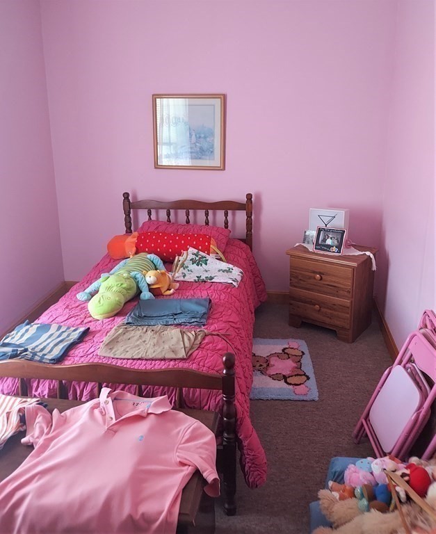 30 Carver Street Fall River, MA 02721 - Photo 17 of 19 a bedroom with a bed and a couch