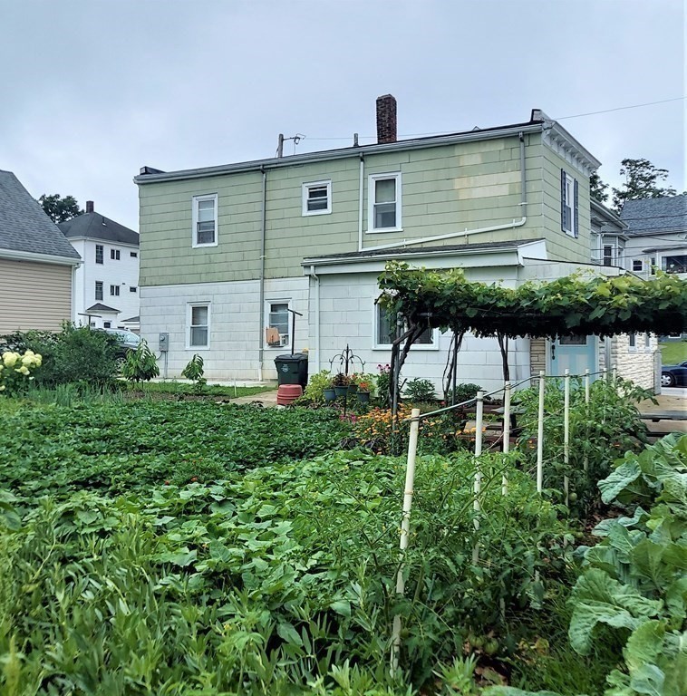30 Carver Street Fall River, MA 02721 - Photo 19 of 19 a backyard of a house with table and chairs