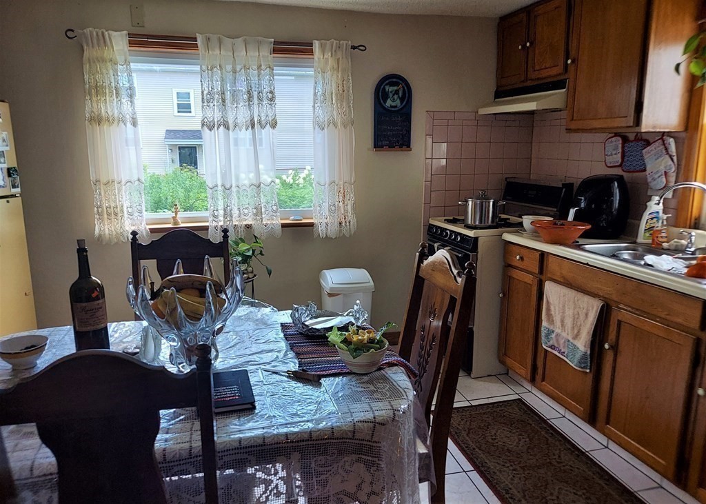 30 Carver Street Fall River, MA 02721 - Photo 4 of 19 a view of a dining room with furniture window and outside view