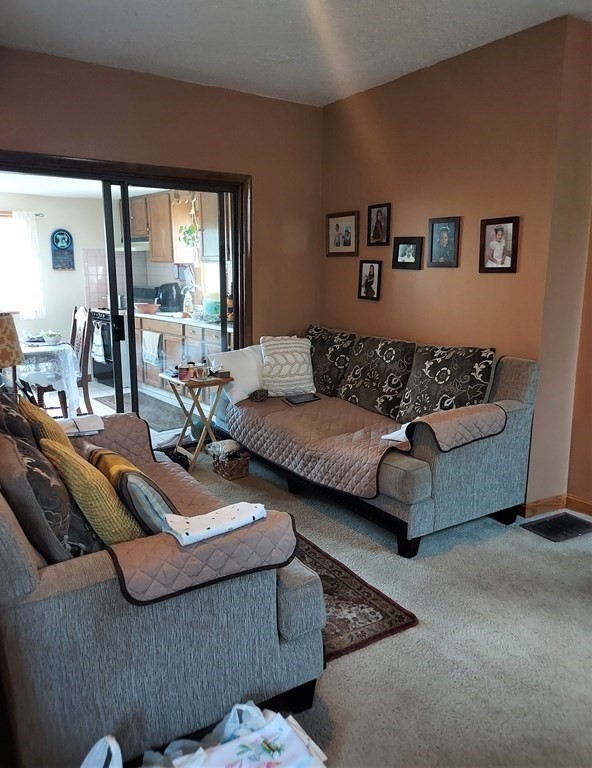 30 Carver Street Fall River, MA 02721 - Photo 6 of 19 a living room with furniture and a large window