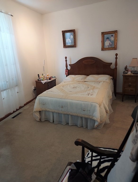 30 Carver Street Fall River, MA 02721 - Photo 9 of 19 a bedroom with a bed and dresser