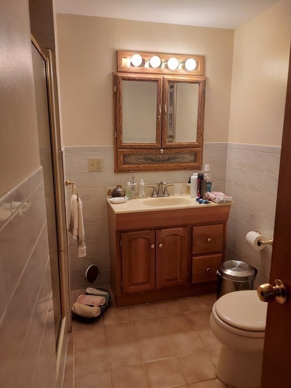 30 Carver Street Fall River, MA 02721 - Photo 10 of 19 a bathroom with a toilet sink and mirror
