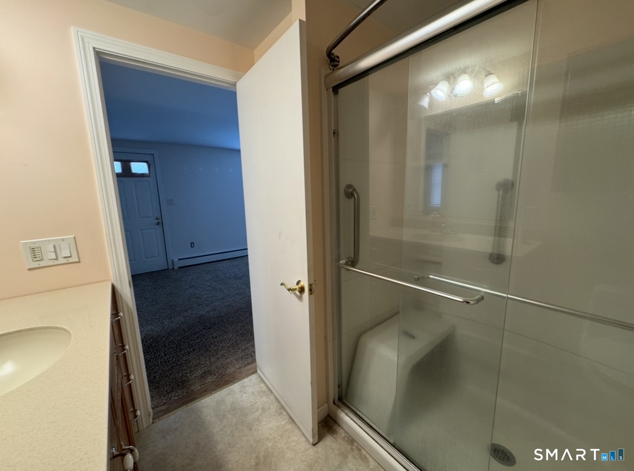 25 Wawecus Hill Road Norwich, CT 06360 - Photo 11 of 13 a bathroom with a glass shower door