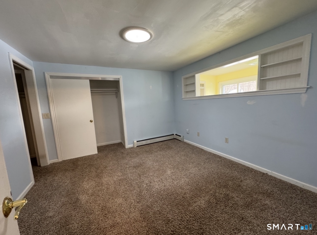 25 Wawecus Hill Road Norwich, CT 06360 - Photo 12 of 13 an empty room with windows