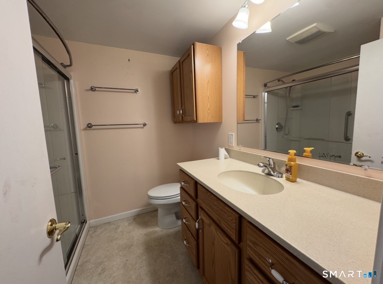 25 Wawecus Hill Road Norwich, CT 06360 - Photo 12 of 13 a bathroom with a sink a toilet and a mirror
