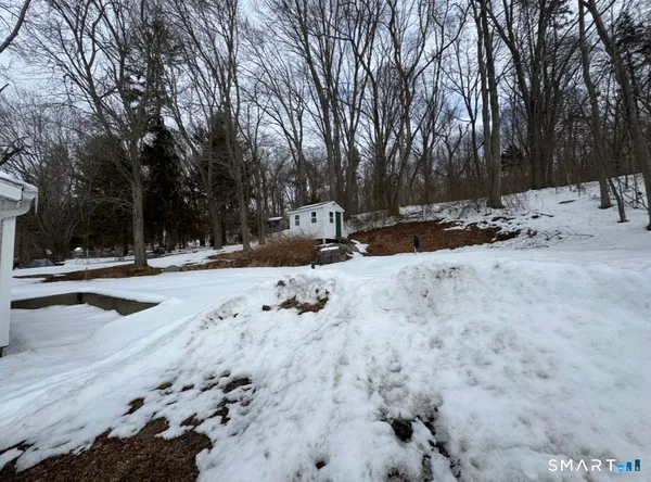 a view of road with snow on the road