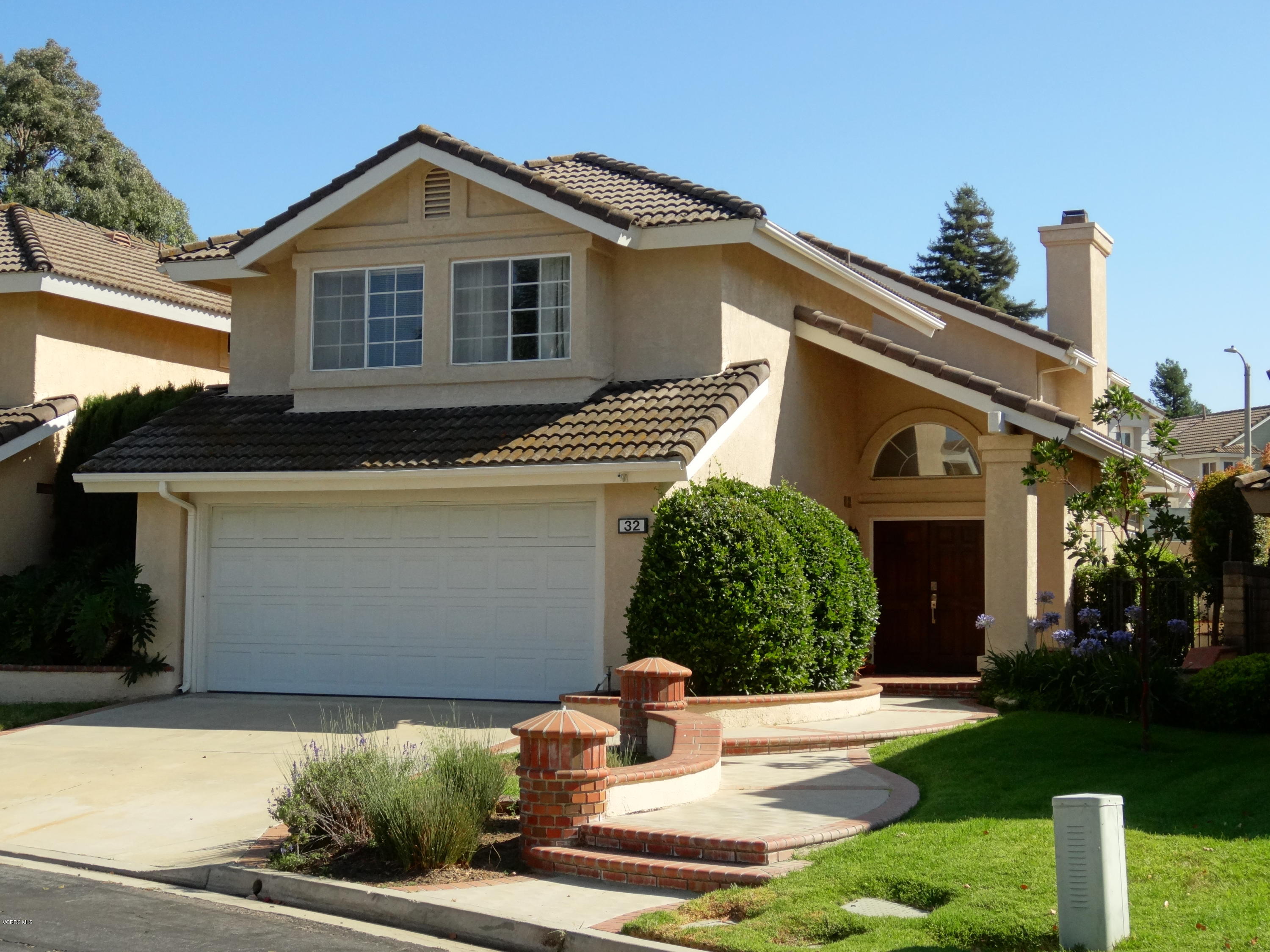 32 Valley Crest Road Simi Valley, CA 93065 - Photo 2 of 39 a front view of a house with a yard