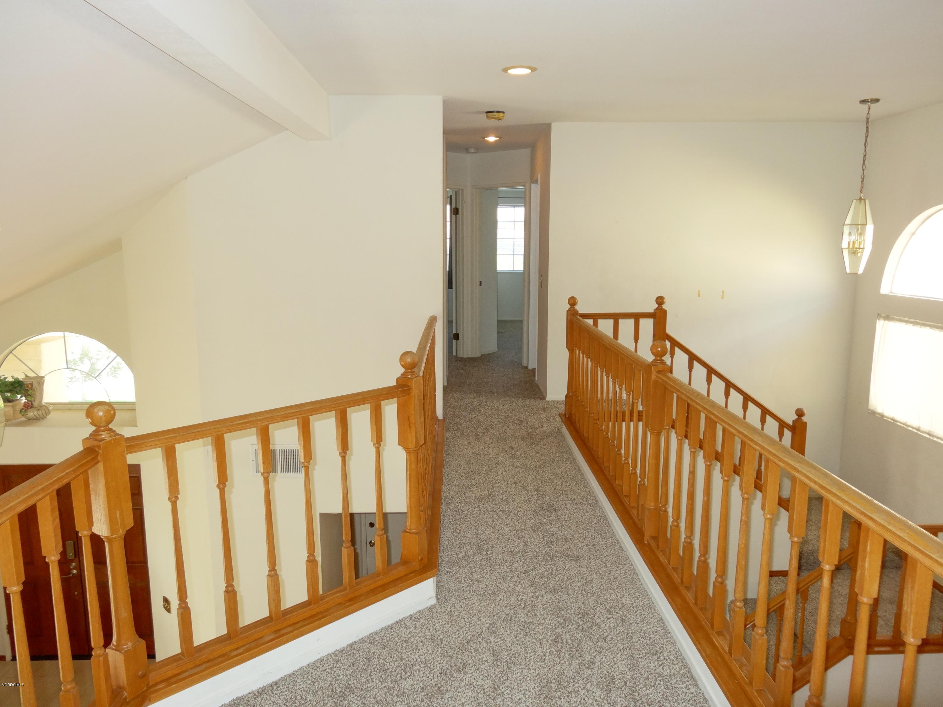 32 Valley Crest Road Simi Valley, CA 93065 - Photo 13 of 39 a view of a hallway with wooden floor