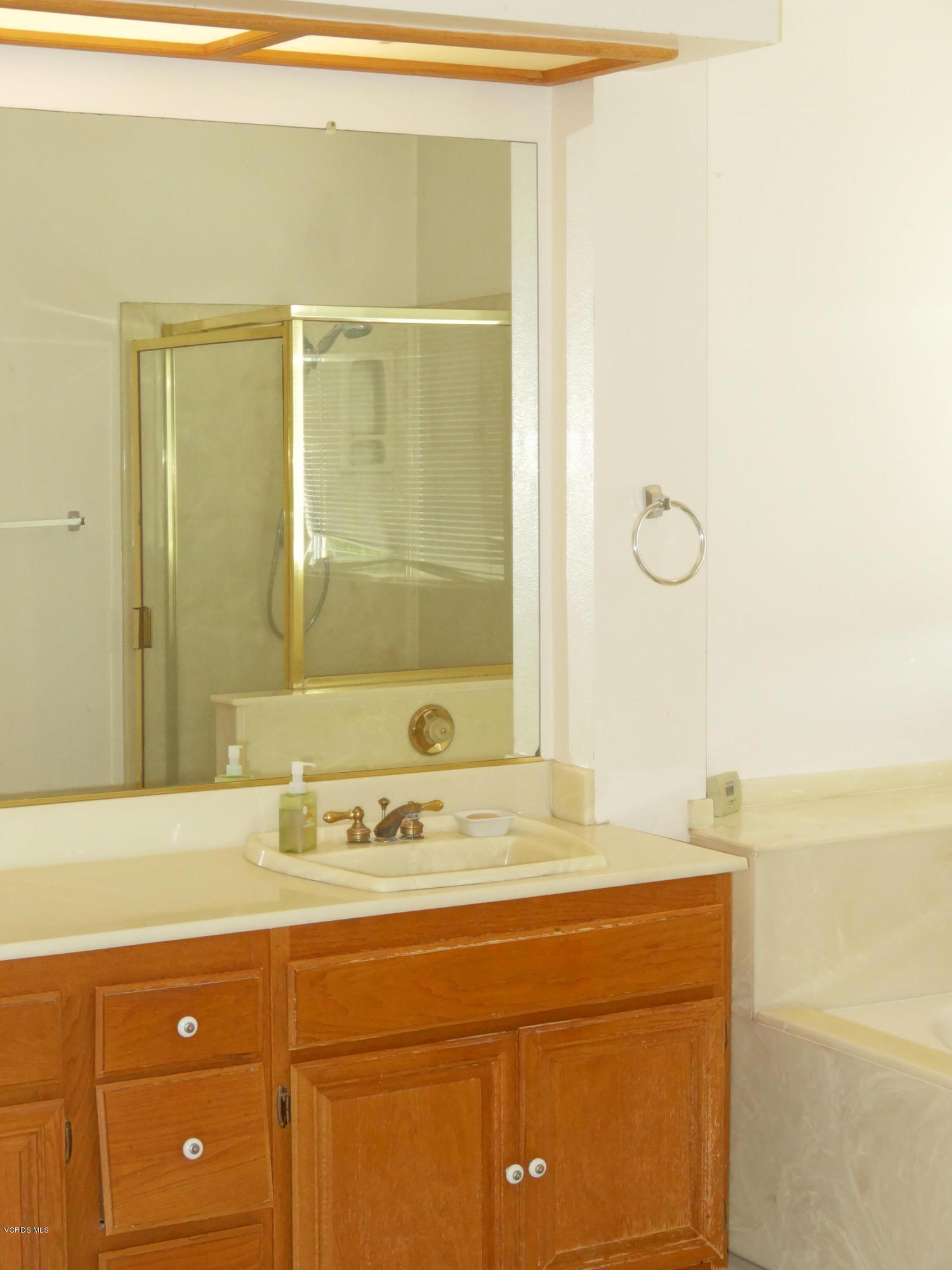 32 Valley Crest Road Simi Valley, CA 93065 - Photo 18 of 39 a bathroom with a sink and a mirror