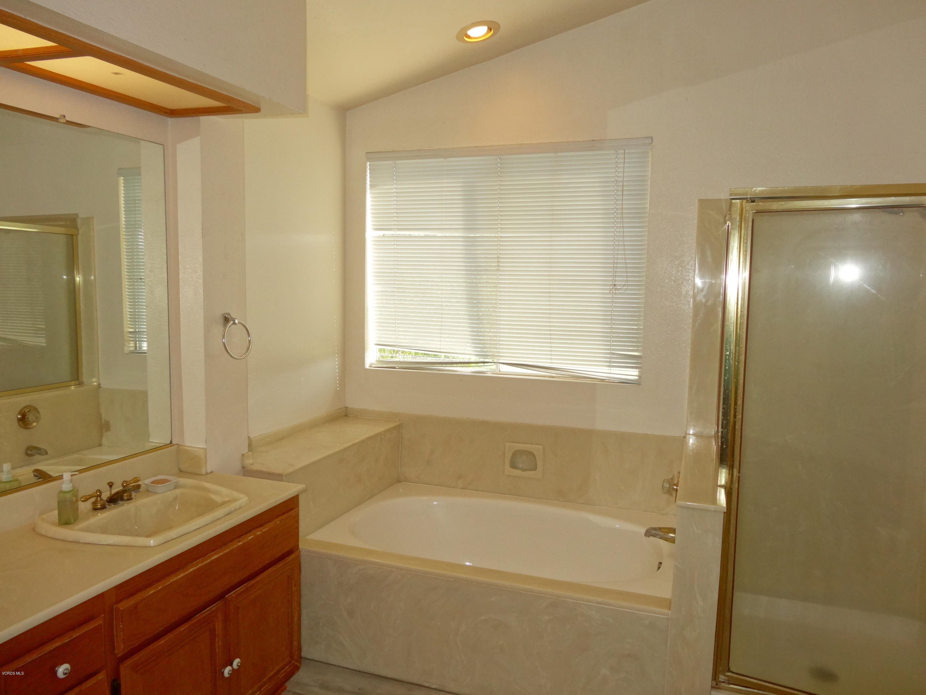 32 Valley Crest Road Simi Valley, CA 93065 - Photo 19 of 39 a bathroom with a granite countertop sink a toilet and shower