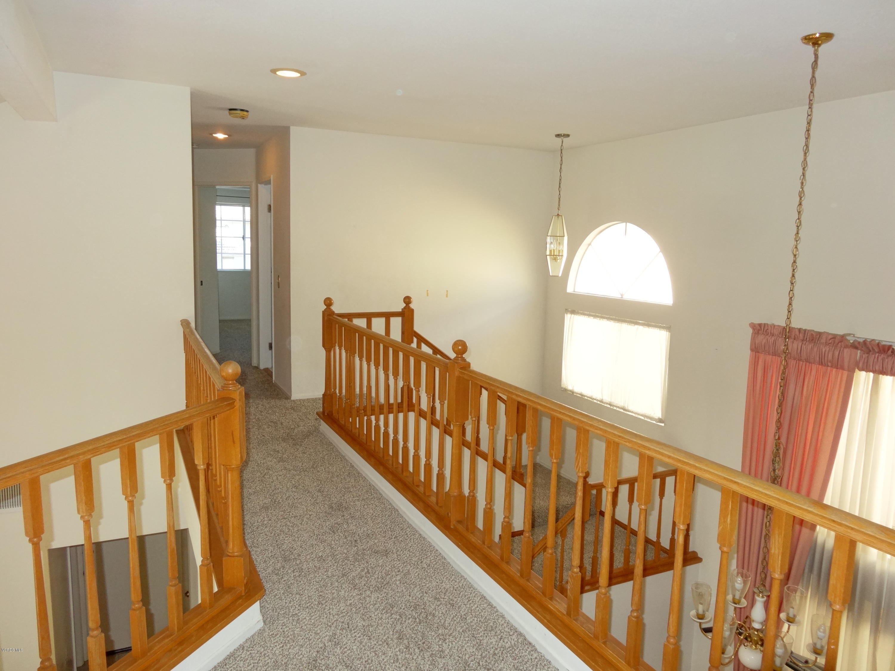 32 Valley Crest Road Simi Valley, CA 93065 - Photo 23 of 39 a view of staircase with railing and a chandelier
