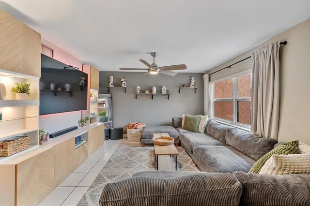 a living room with furniture and a large window