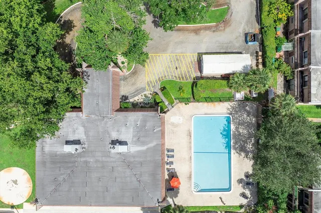 an aerial view of a house with outdoor space