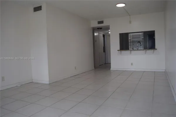 a kitchen with a sink and a window