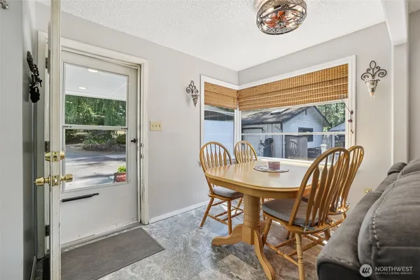 a view of a dining room with furniture window and outside view