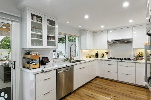 a kitchen with a stove and a microwave