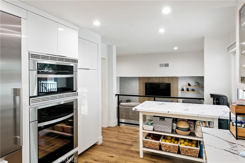 24411 Highlander Road West Hills, CA 91307 - Photo 12 of 58 a kitchen with a stove and a microwave