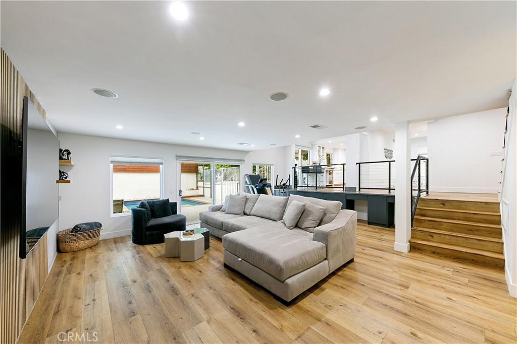 24411 Highlander Road West Hills, CA 91307 - Photo 14 of 58 a living room with furniture and a flat screen tv