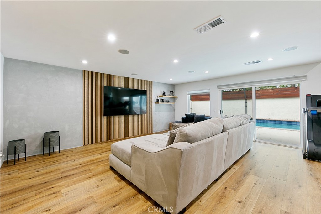 24411 Highlander Road West Hills, CA 91307 - Photo 15 of 58 a living room with furniture and a flat screen tv