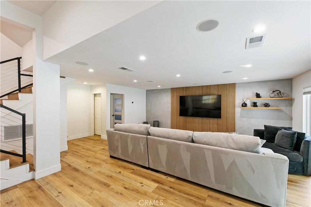 24411 Highlander Road West Hills, CA 91307 - Photo 16 of 58 a living room with furniture and a flat screen tv
