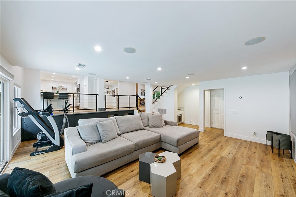 24411 Highlander Road West Hills, CA 91307 - Photo 17 of 58 a living room with furniture and a wooden floor