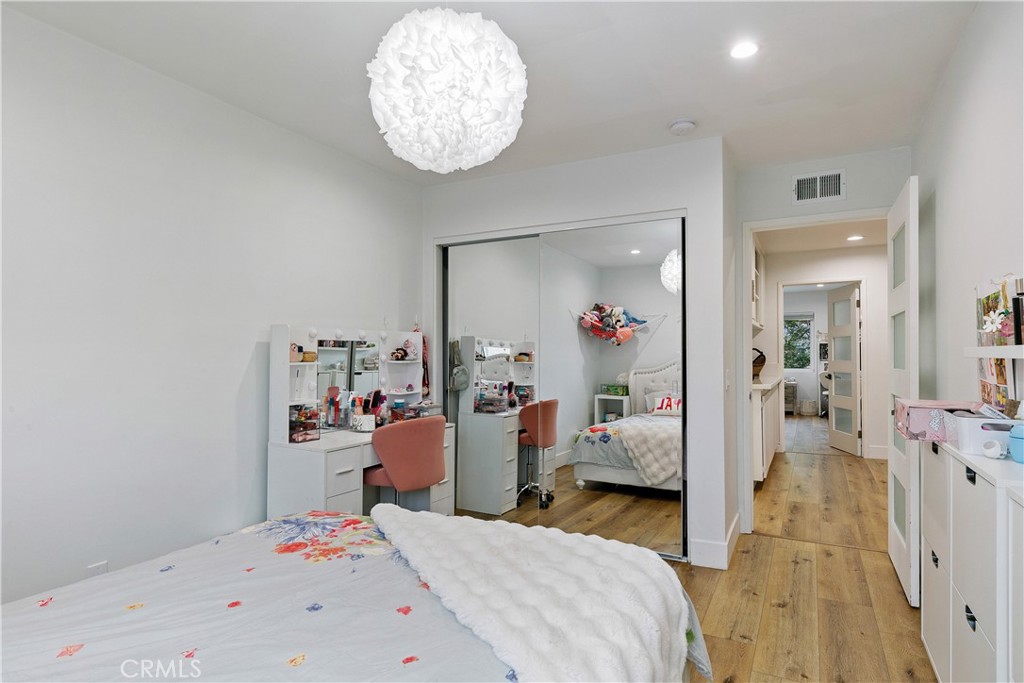 24411 Highlander Road West Hills, CA 91307 - Photo 25 of 58 a bedroom with bed and wooden floor