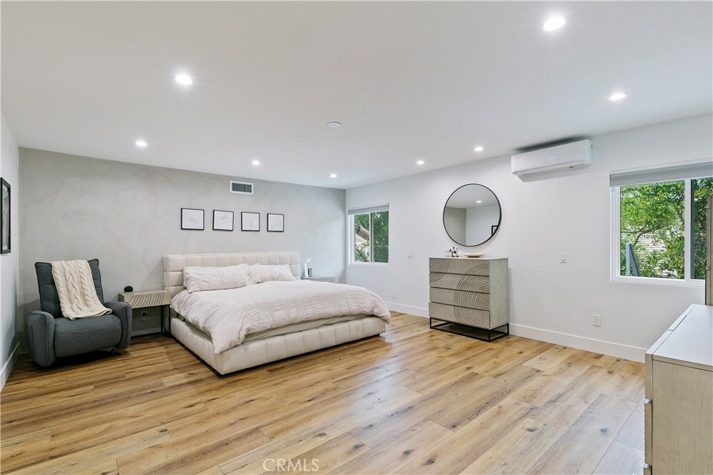 24411 Highlander Road West Hills, CA 91307 - Photo 31 of 58 a bedroom with a large bed and a chair