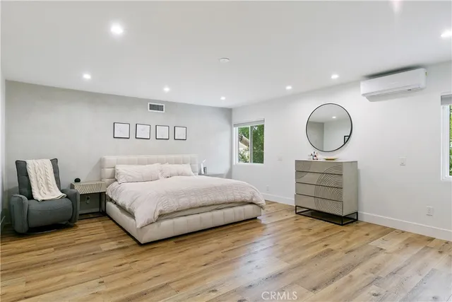 a spacious bathroom with a double vanity sink and a mirror