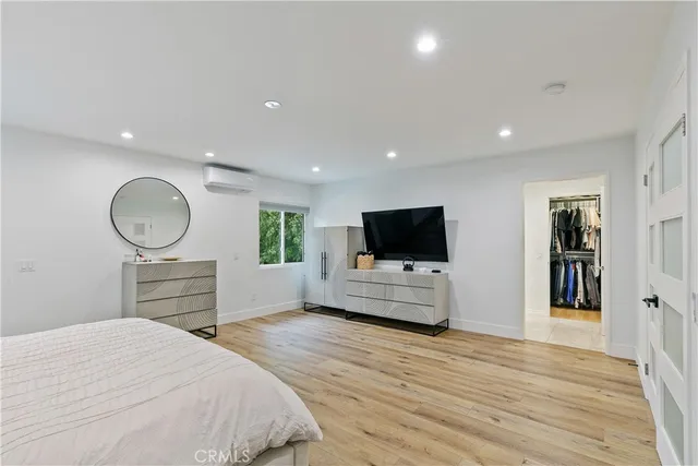 a bedroom with furniture and a bed