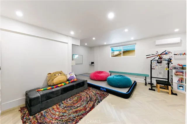 a view of a house with a swimming pool and sitting area