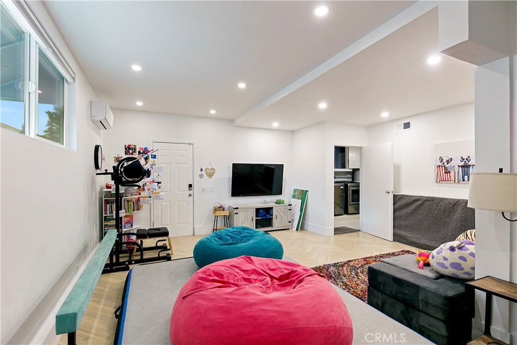 24411 Highlander Road West Hills, CA 91307 - Photo 39 of 58 a living room with furniture and a flat screen tv