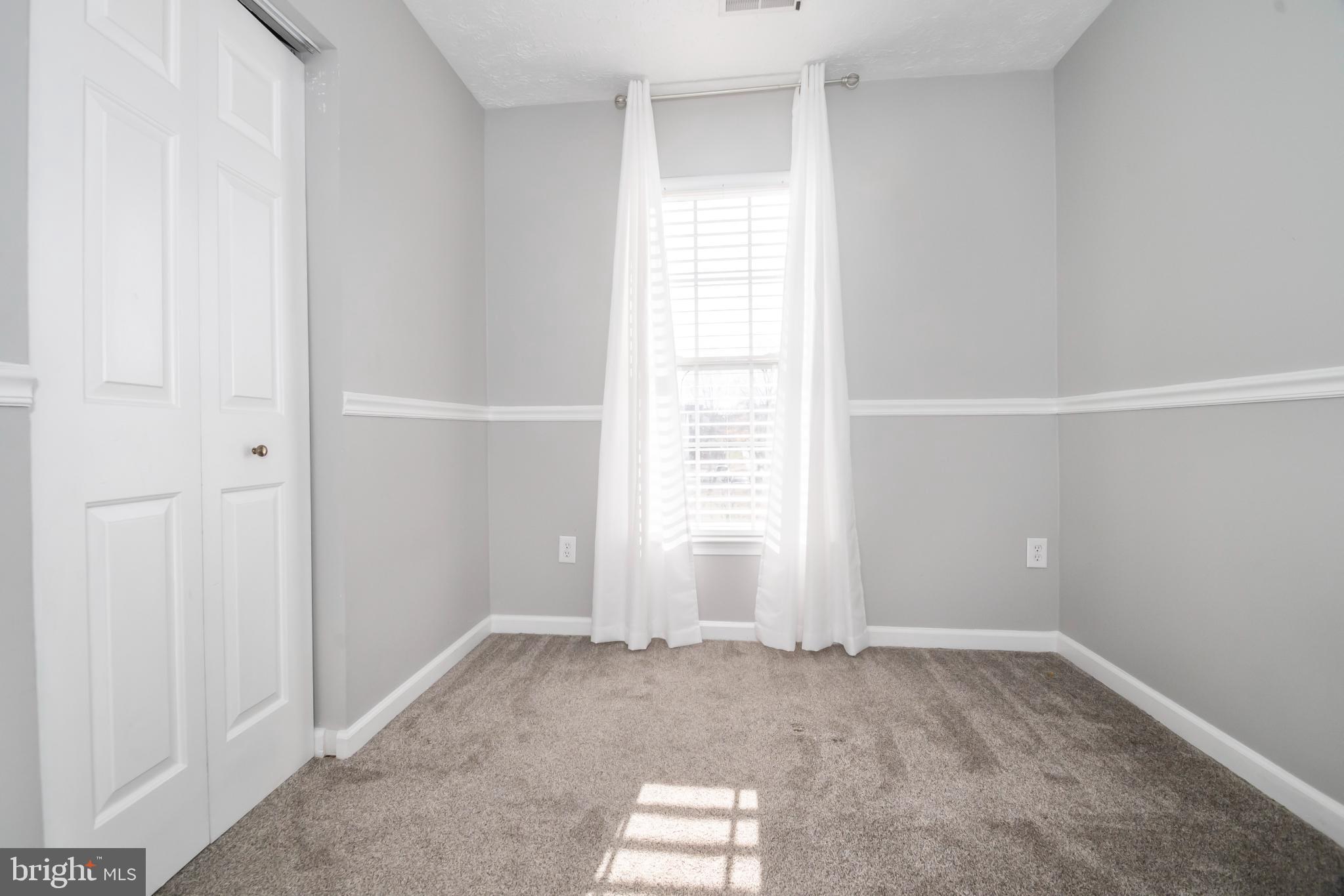 5224 Leavers Court Rosedale, MD 21237 - Photo 11 of 27 an empty room with windows