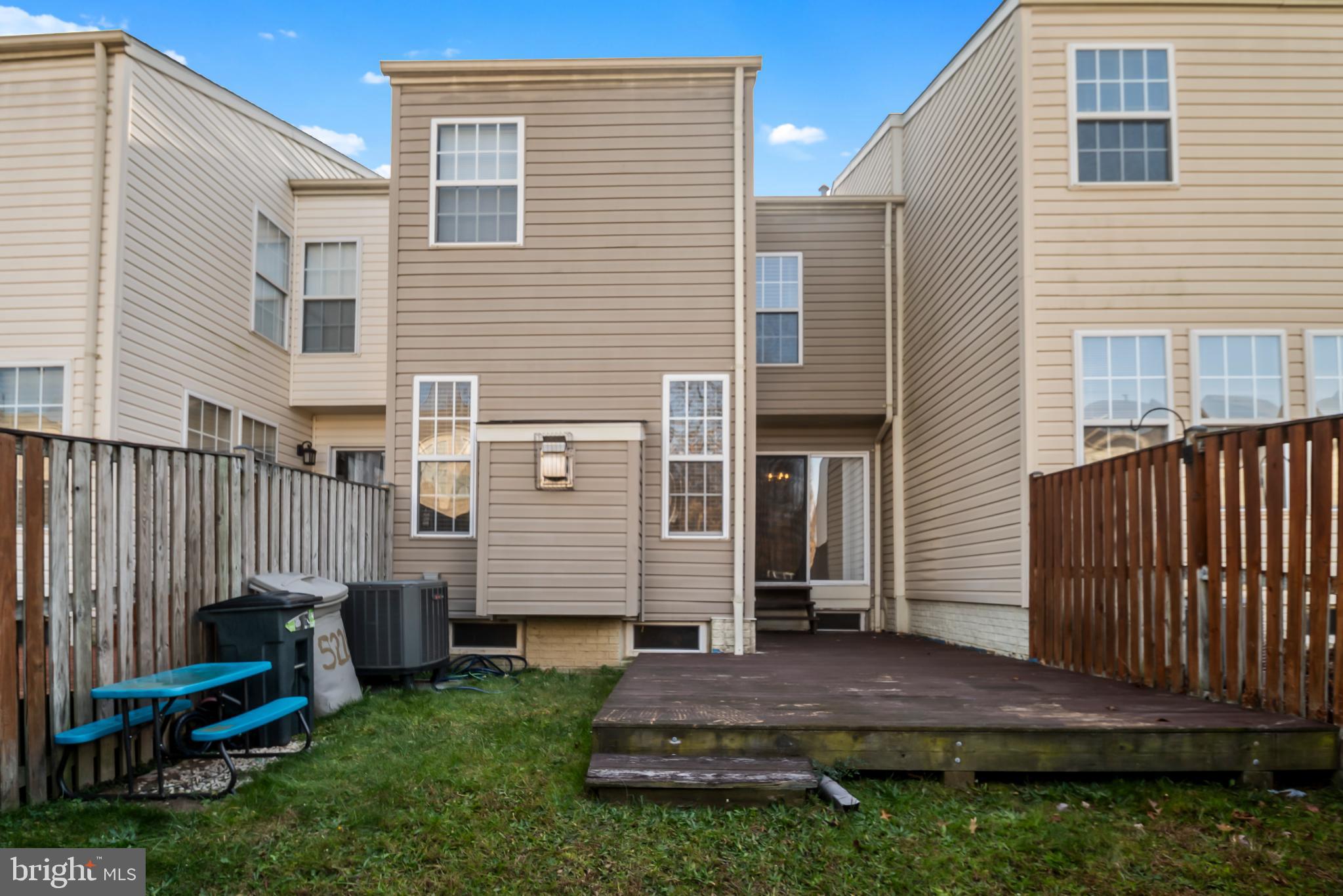 5224 Leavers Court Rosedale, MD 21237 - Photo 27 of 27 a view of backyard with barbeque grill and wooden fence