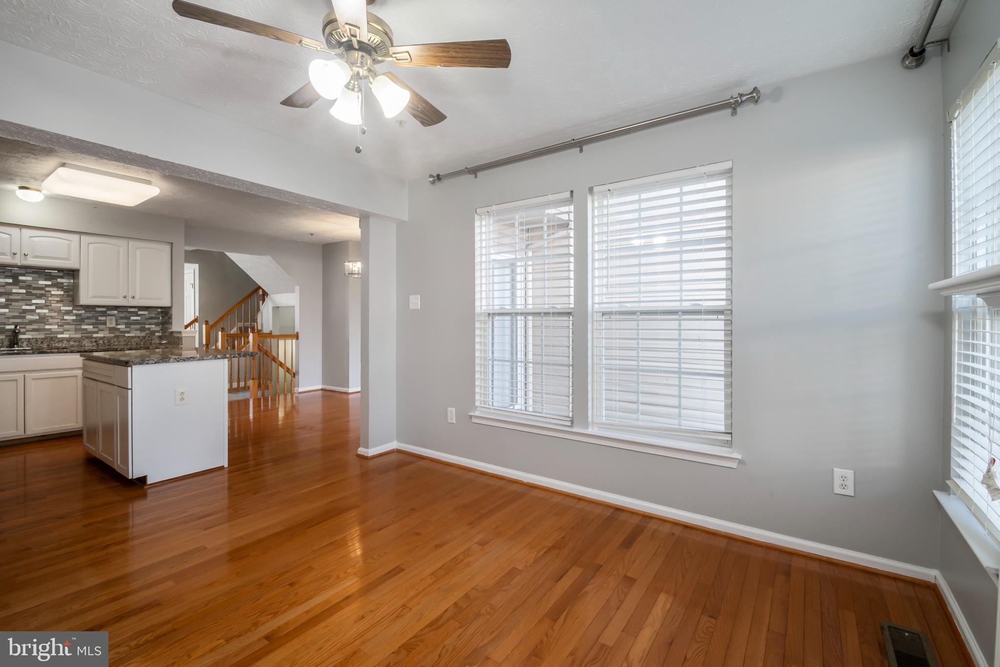 5224 Leavers Court Rosedale, MD 21237 - Photo 7 of 27 a view of kitchen with furniture and wooden floor