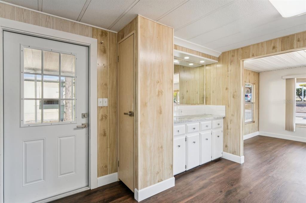 15071 Rialto Avenue Brooksville, FL 34613 - Photo 13 of 41 a view of a hallway with wooden floor